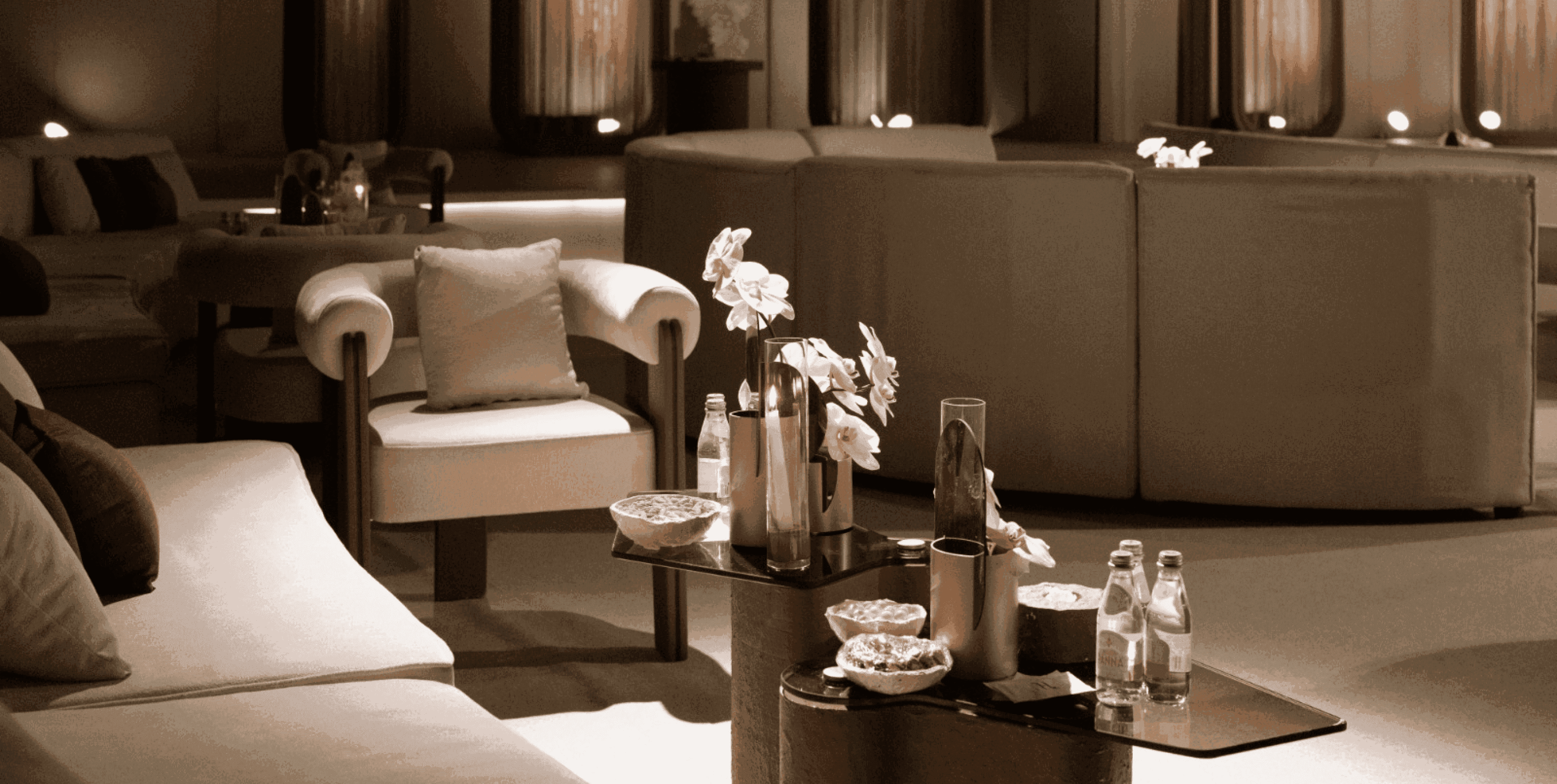 Elegant lounge-style wedding setup with warm lighting